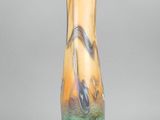 a glass vase that is sitting on a table