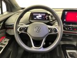 the interior of a car with a steering wheel and a touch screen