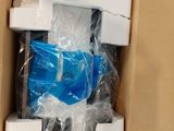 a cardboard box with a pair of scissors inside of it