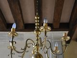 a chandelier that is hanging from the ceiling