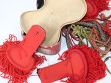 a red pair of gloves and a red glove on a white surface