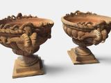 two vases that are sitting next to each other on a table