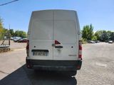 a white van that is parked on the side of the road