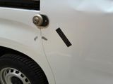 a close up of a white truck with a black sticker on it