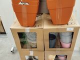 two orange pots on top of each other on a carton
