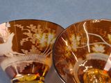 two bowls that are sitting next to each other on a table