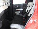 a red car with black seats in the back of it