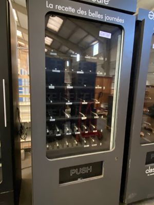 two vending machines that are on display in a store