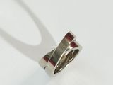 an image of a silver ring on a white surface
