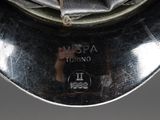 a close up of a silver plate on a table