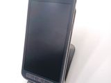 a cell phone that is sitting on top of a stand