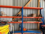 a truck that is parked in a garage next to a shelf