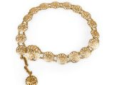 a gold bracelet with a heart charm on it