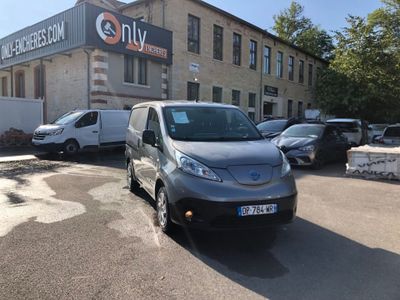 cars parked in a parking lot in front of a building
