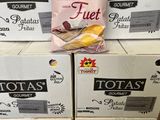boxes of potato chips stacked on top of each other in a store