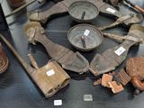 a lot of old tools on display in a glass case