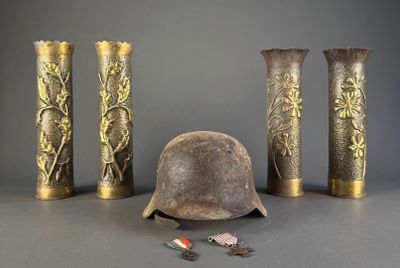 three vases and a helmet sitting on a table