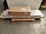 a box sitting on top of a pallet in a warehouse