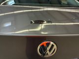 a close up of a vw logo on a car