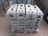 a stack of concrete blocks sitting on a pallet