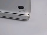 a close up of a silver cell phone on a table