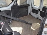 a seat in the back of a van with a seat belt