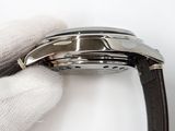 a close up of a watch being held by a glove