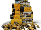 a lot of construction vehicles that are in a pile