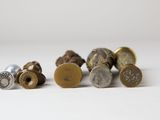 a close up of a bunch of different types of bullet shells