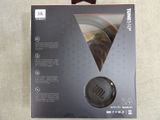 the box of a pair of headphones is open on the table