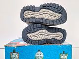a pair of shoes that are on top of a box