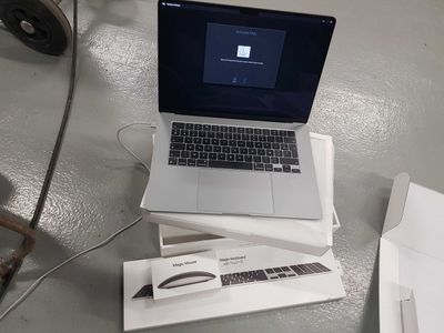 a laptop computer sitting on top of a box on a table