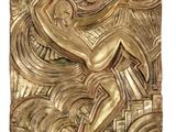 an image of a gold sculpture of a man sitting on top of a table