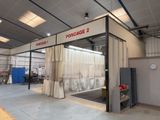 a photo of a garage with a large open door