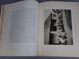 an open book with a picture of a group of people sitting at a table