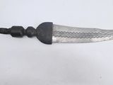 a knife that is laying on a table