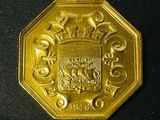 an image of a gold coin with a coat of arms on it