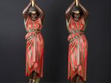 pair of antique bronze figurines of a woman holding a lamp