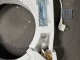 a picture of a toilet seat with the lid down