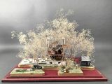 a miniature model of a house on a red platform