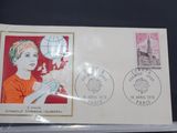 an envelope with a picture of a boy holding a globe