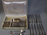 a box with silverware in it on a table