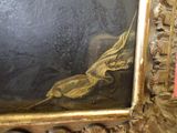 a picture of a painting in a gold frame on the wall
