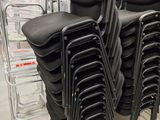 a lot of chairs that are stacked on top of each other