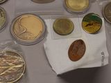 a lot of coins that are on a table