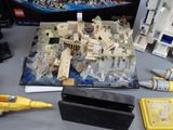 a box of legos sitting on a table next to other legos