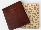 a brown book with a brown cover sitting on top of a white surface