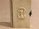 a small book with a picture of a sailor on it