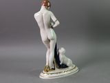 an image of a figurine of a woman with a dog