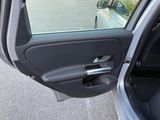 a car door open with the driver ' s side window open